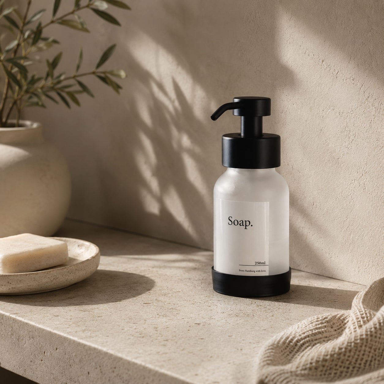 Matte Black freestanding soap dispenser with frost glass, studio shot 2