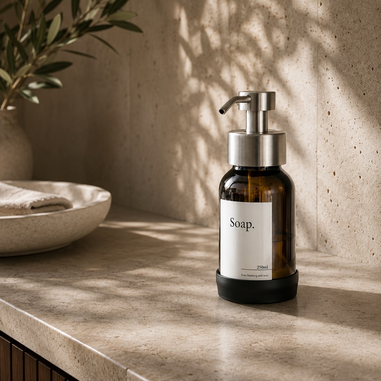 Brushed Steel silver freestanding soap dispenser with brown glass, studio shot 2